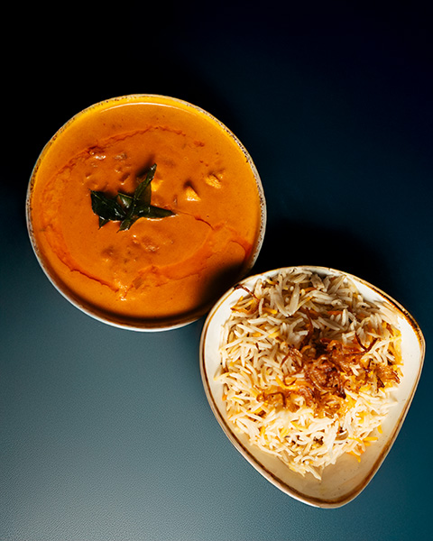 Creamy curry served alongside fragrant basmati rice