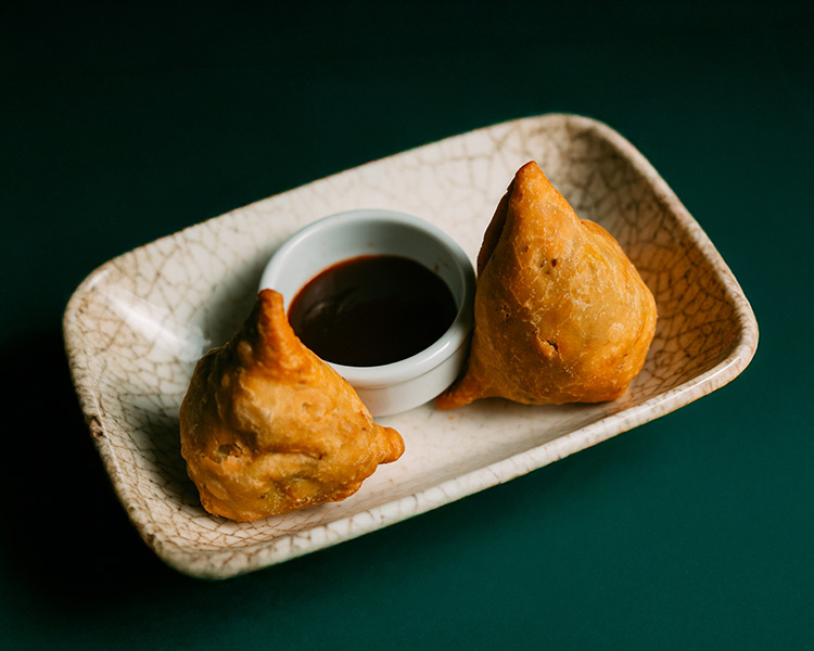 Golden samosas with tamarind chutney